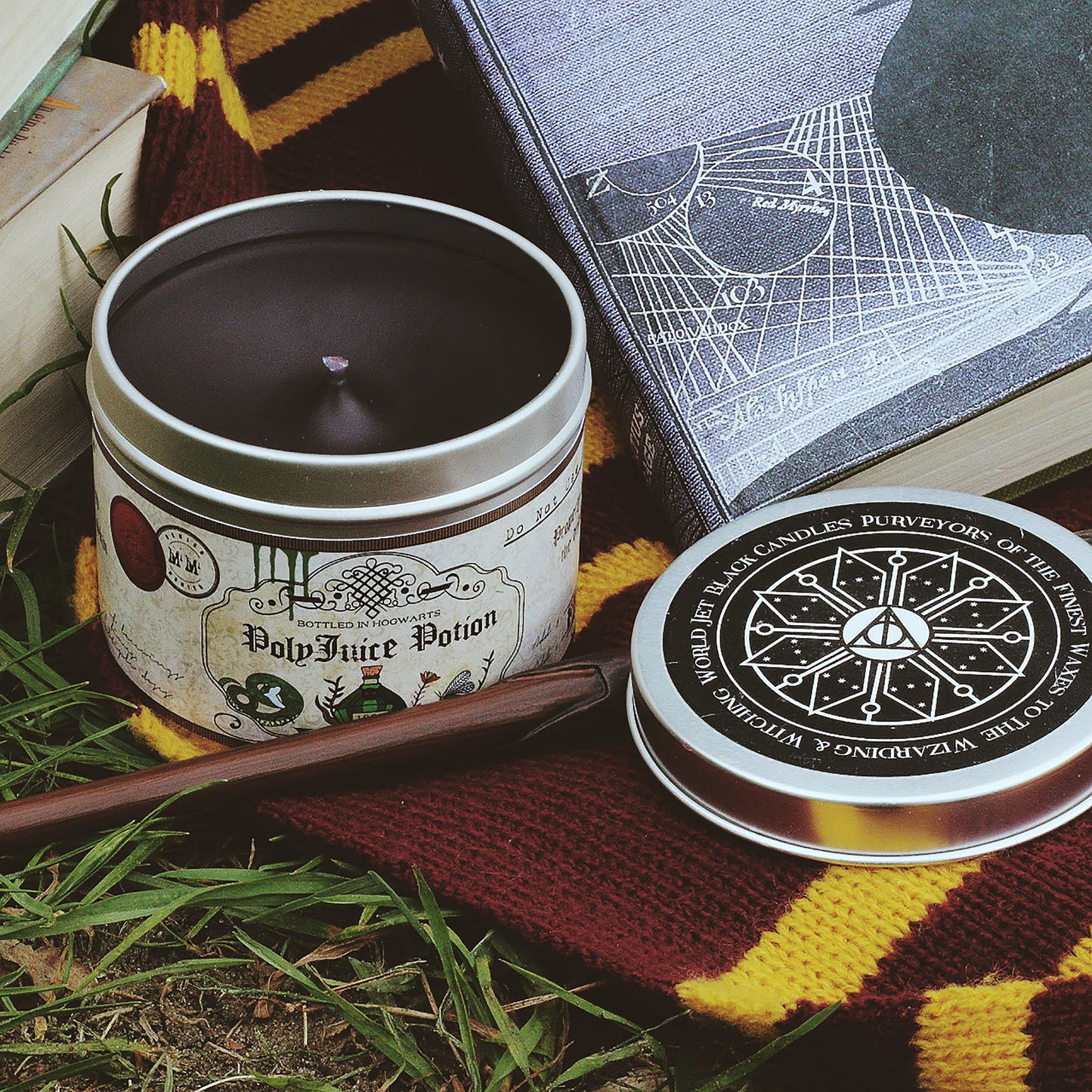 Polyjuice potion scented candle with lid off and black wax.
