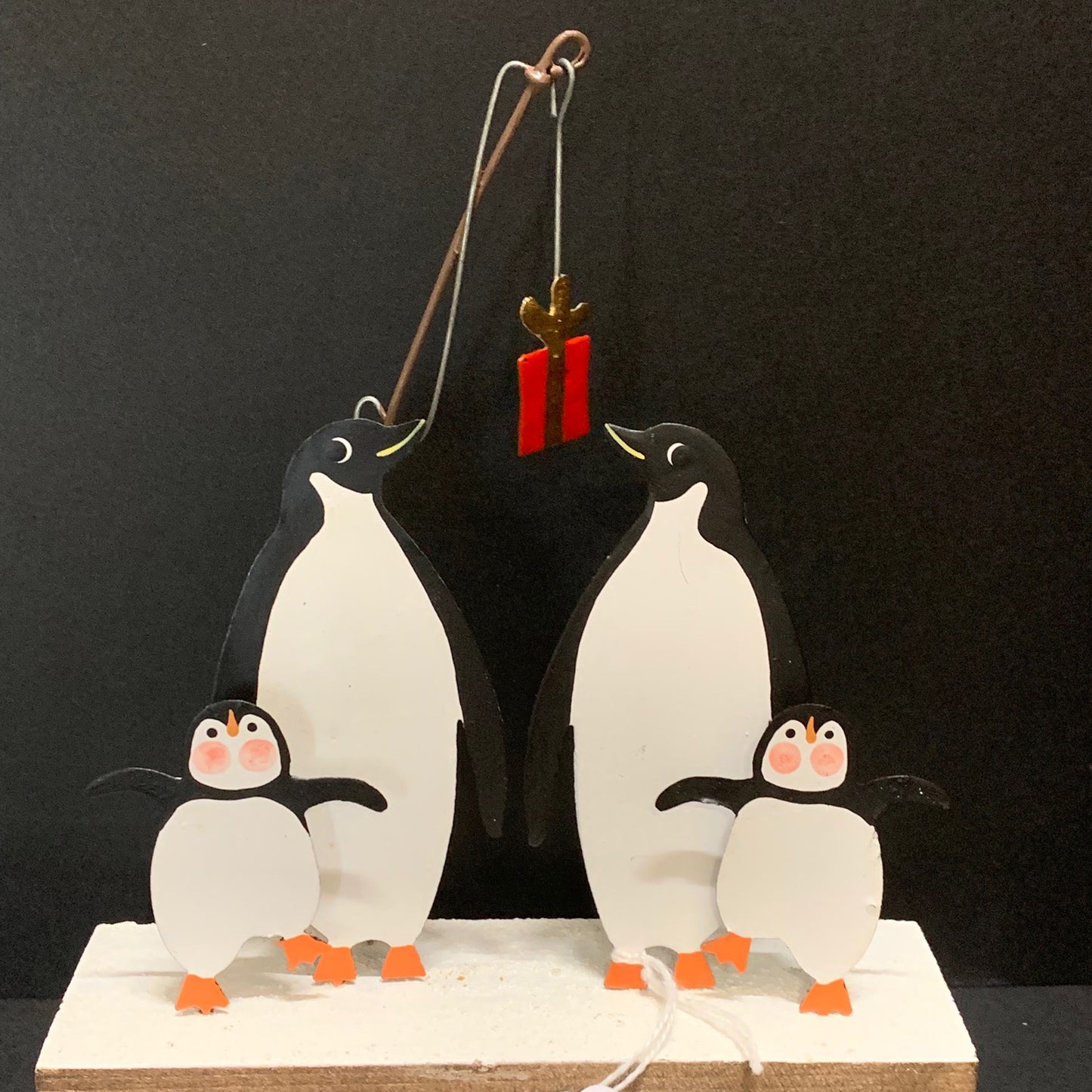 Penguins Fishing for Gifts: Christmas Decoration on a Black Background | Happy Piranha