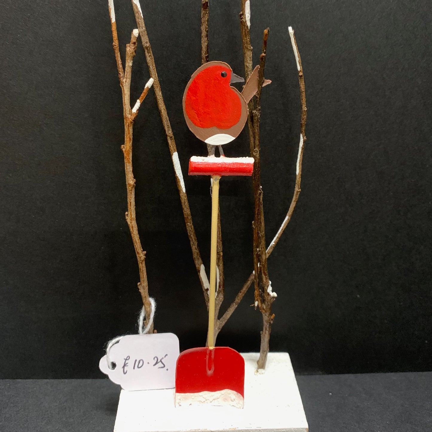 Robin on a Spade: Christmas Decoration on a Black Background | Happy Piranha