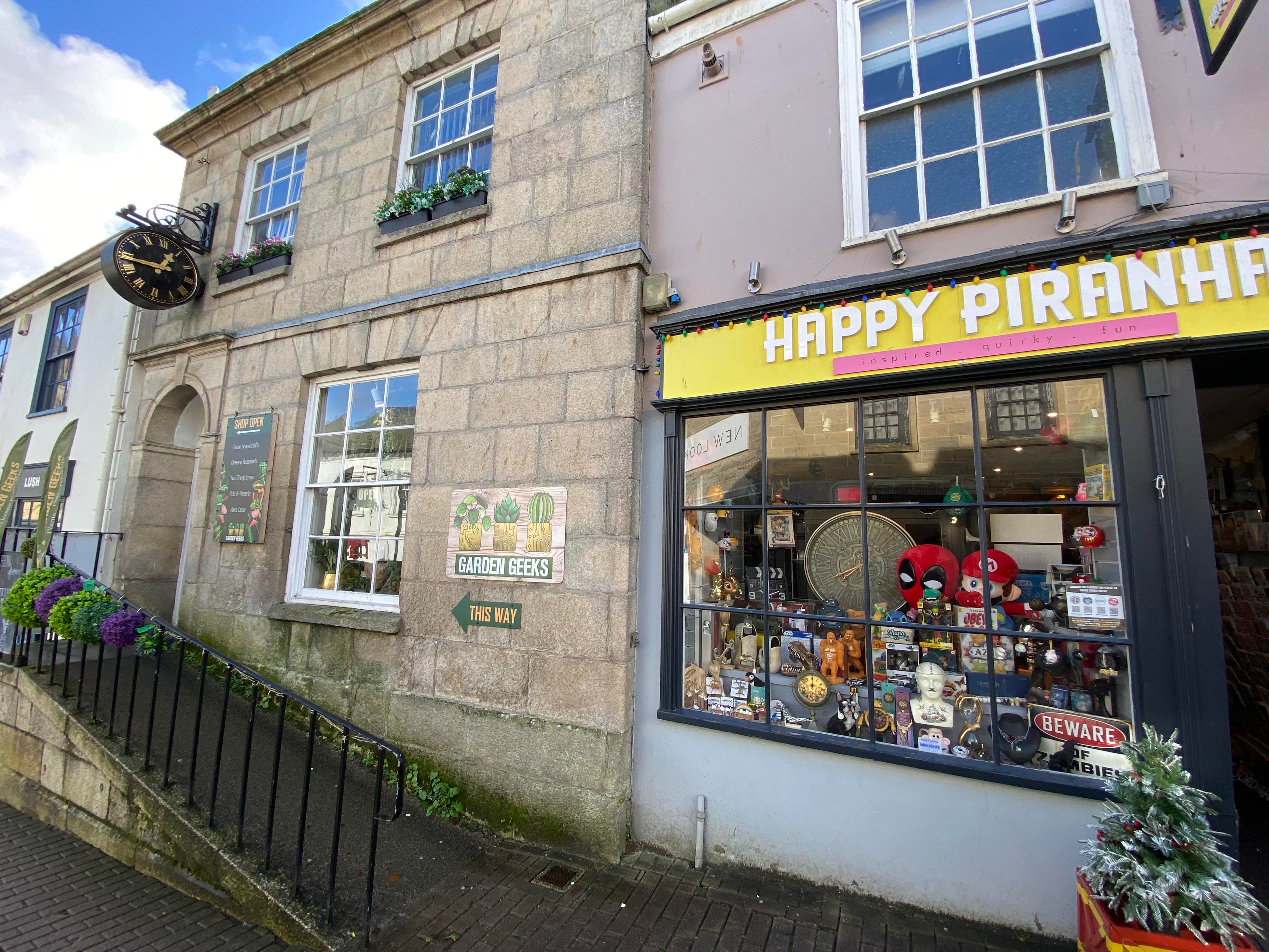 The outside entrance of the Happy Piranha and Garden Geeks stores in Truro, Cornwall.