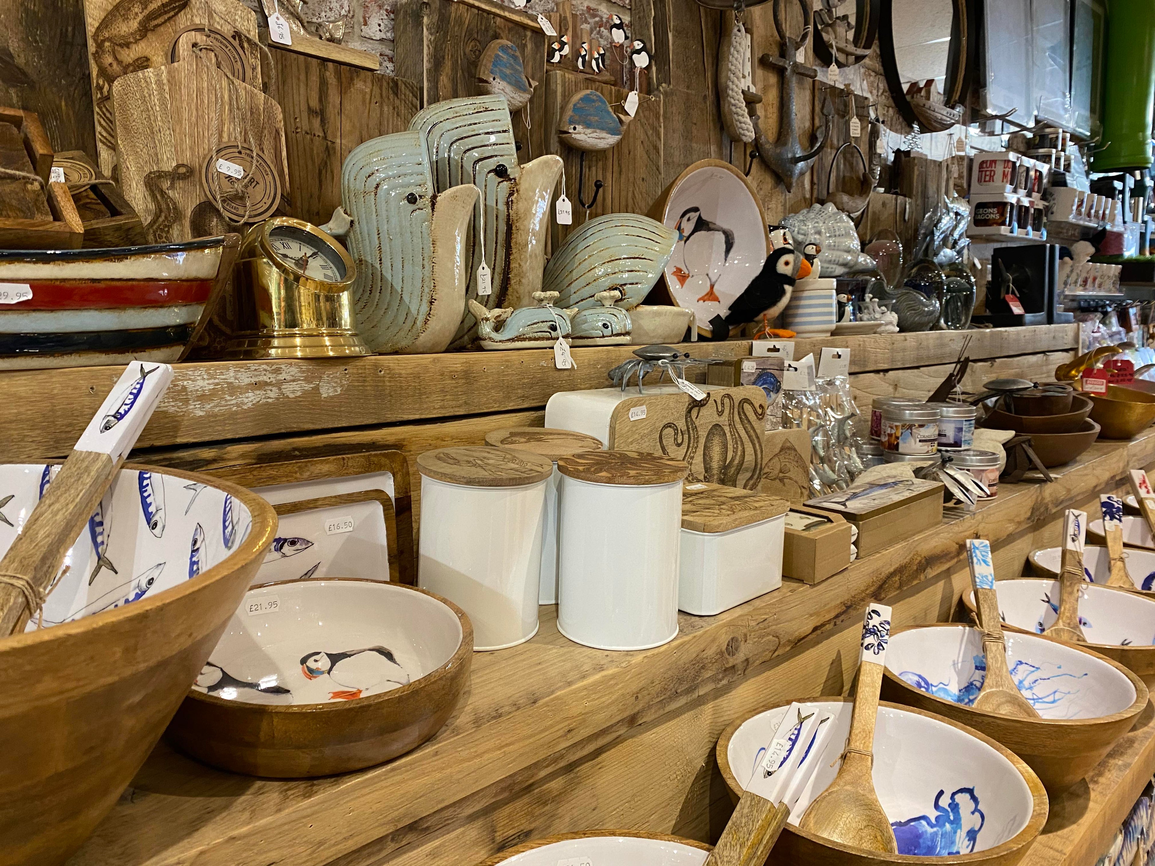 A close up of a shelf at the Happy Piranha shop featuring a selecting of nautical themed bowls and homeware.