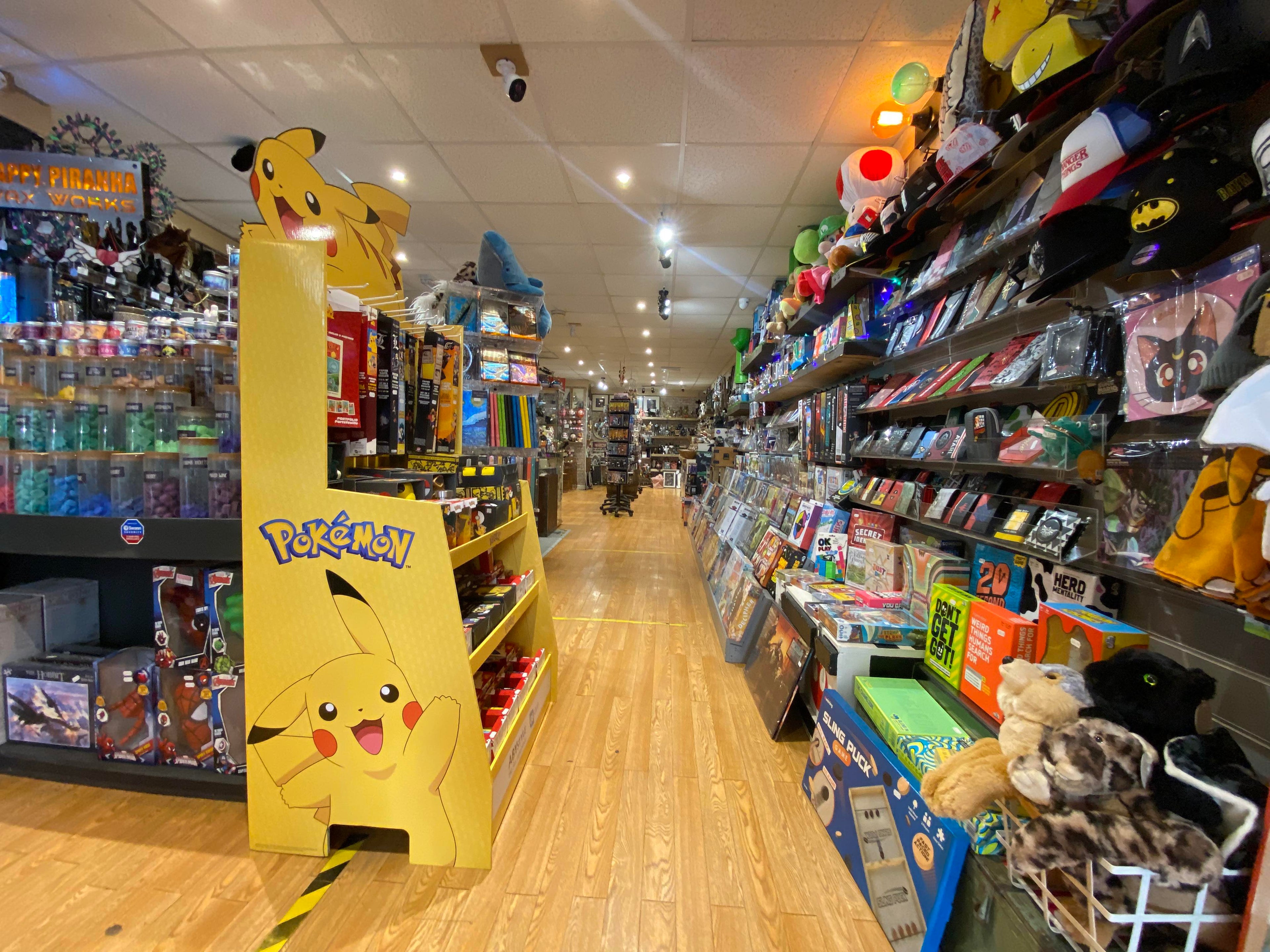 A view of the Happy Piranha store as you first enter inside, featuring board games, wallets and pop culture memorabilia.