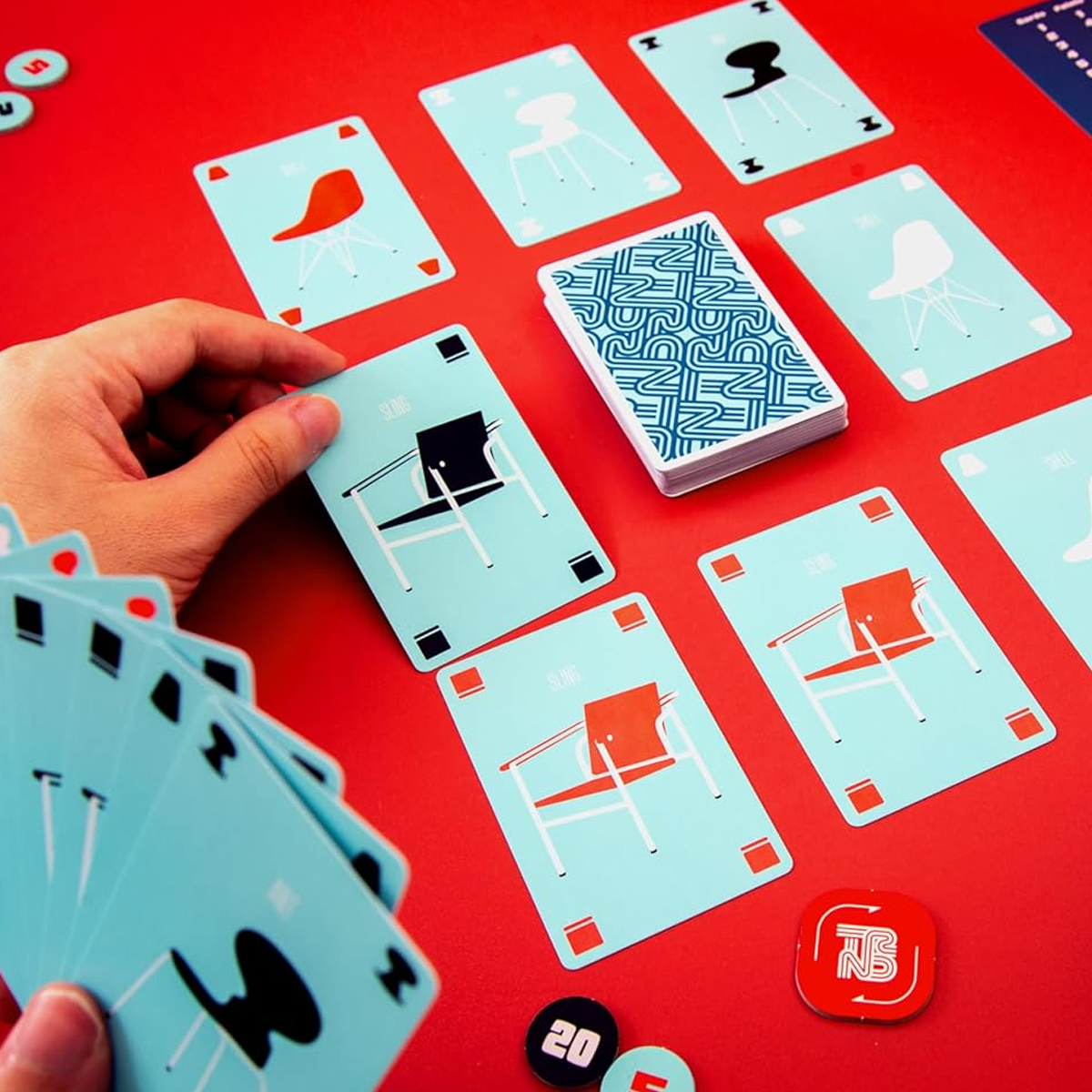 TRND (Track the Trend) Board Game (Being Played on a Red Table) on a White Background | Happy Piranha