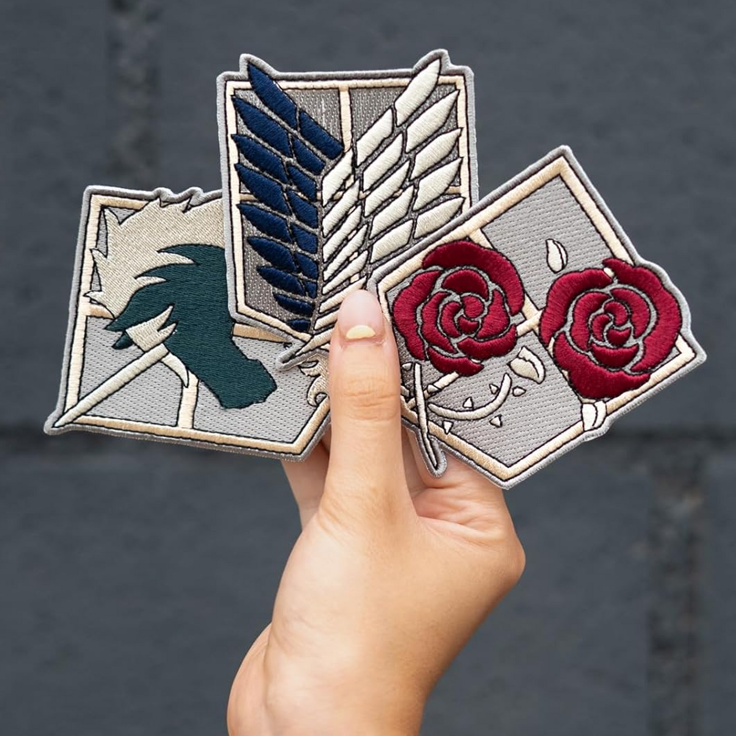 Attack on Titan Iron On Fabric Patches 3 Set in a Person's Hand | Happy Piranha