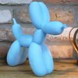 Light Blue Balloon Dog Ornament on a Desk | Happy Piranha