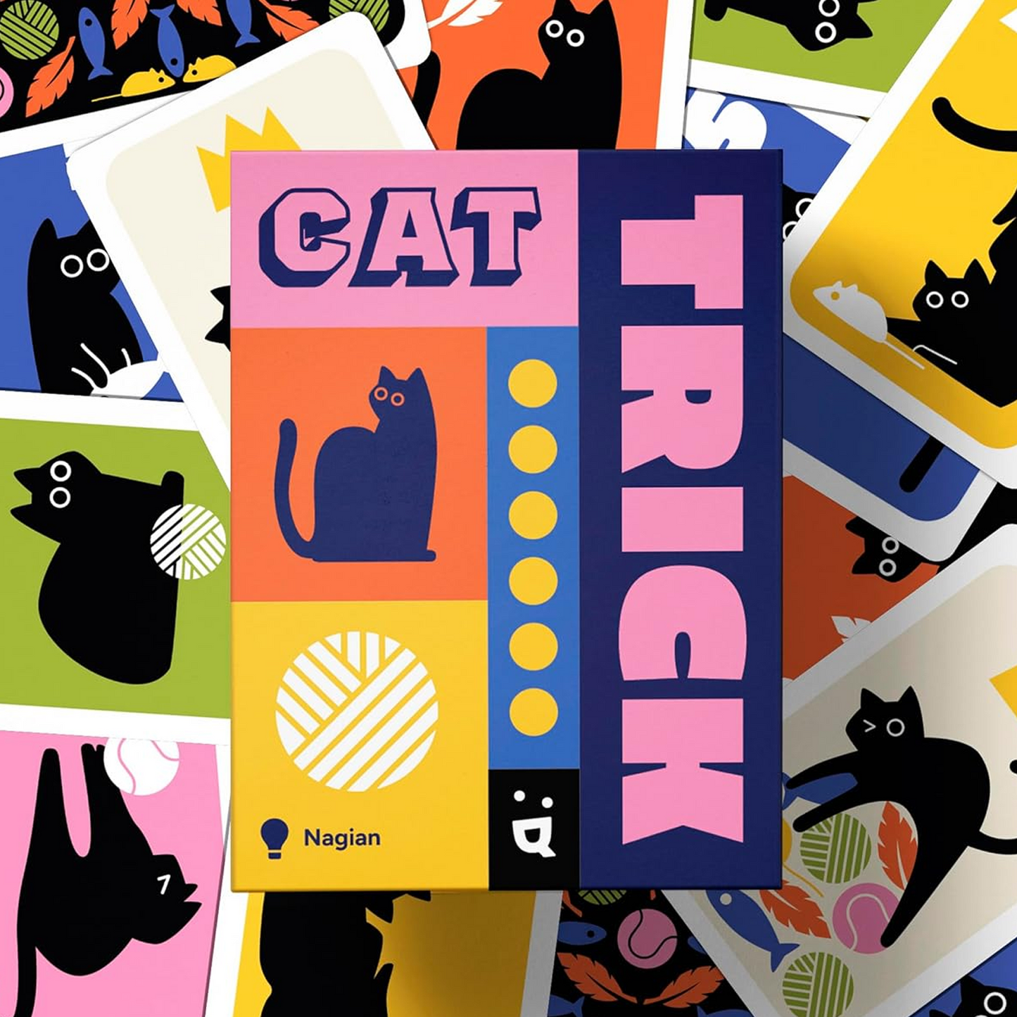 Cat Trick Card Game (Front of Box) on top of lots of Colourful Cards with Cats on | Happy Piranha