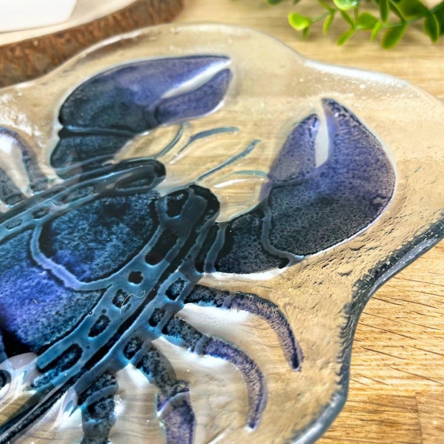 Lobster Shaped Glass Plate on a Wooden Table, Close Up | Happy Piranha