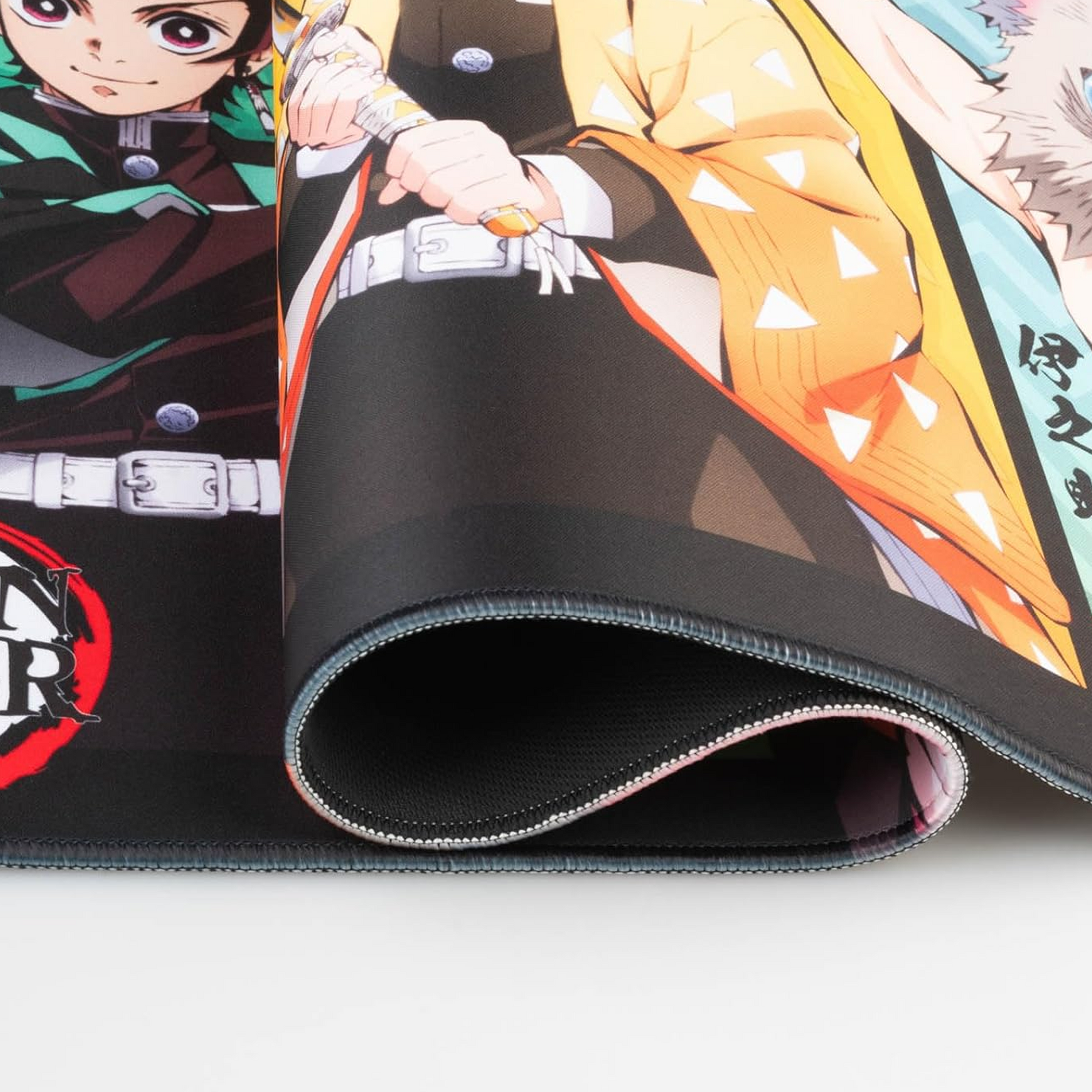 Demon Slayer XXL Anime Mouse Pad & Keyboard Mat - Close up of the Quality Stitched Edging | Happy Piranha