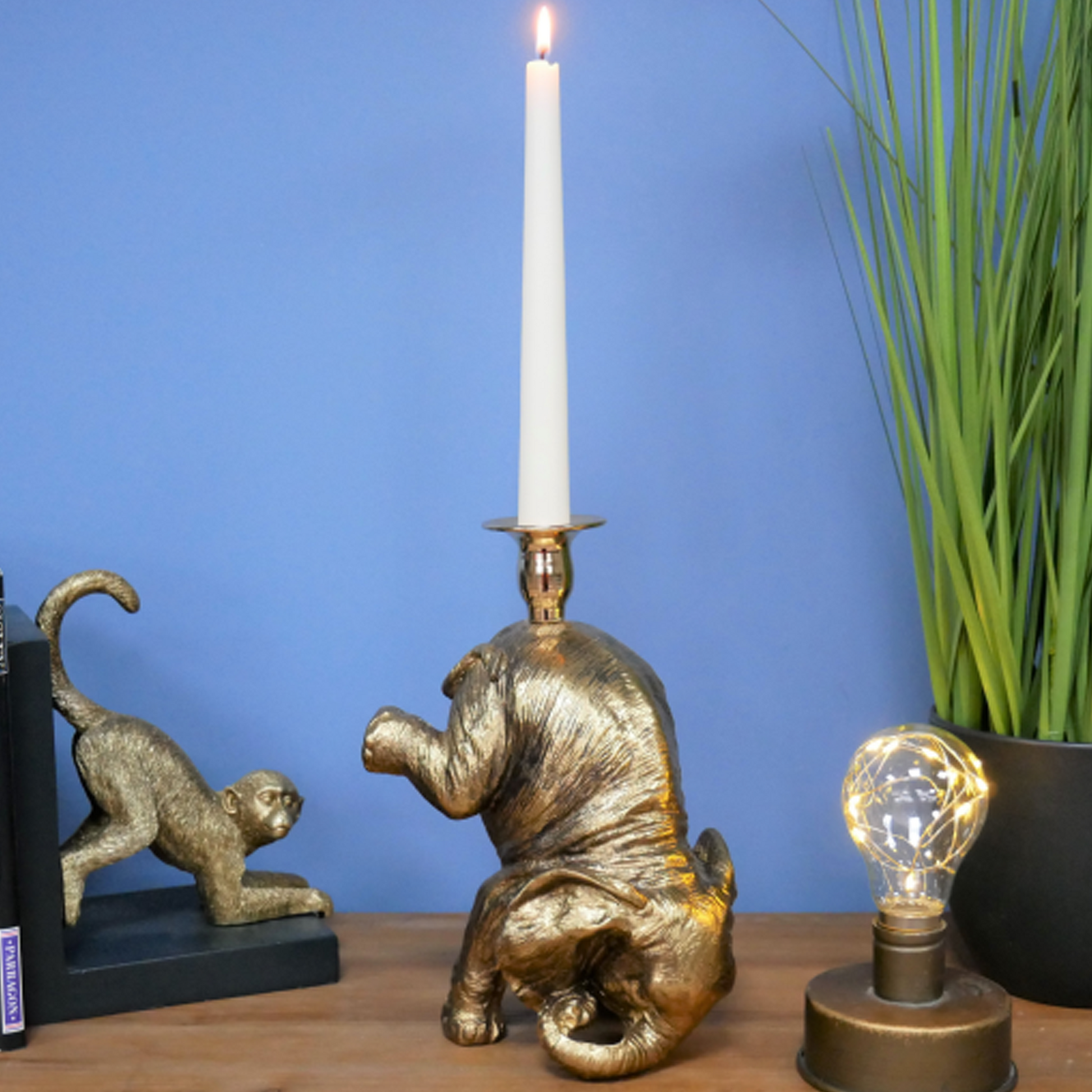 Gold Baby Elephant Candle Holder on a Desk | Happy Piranha