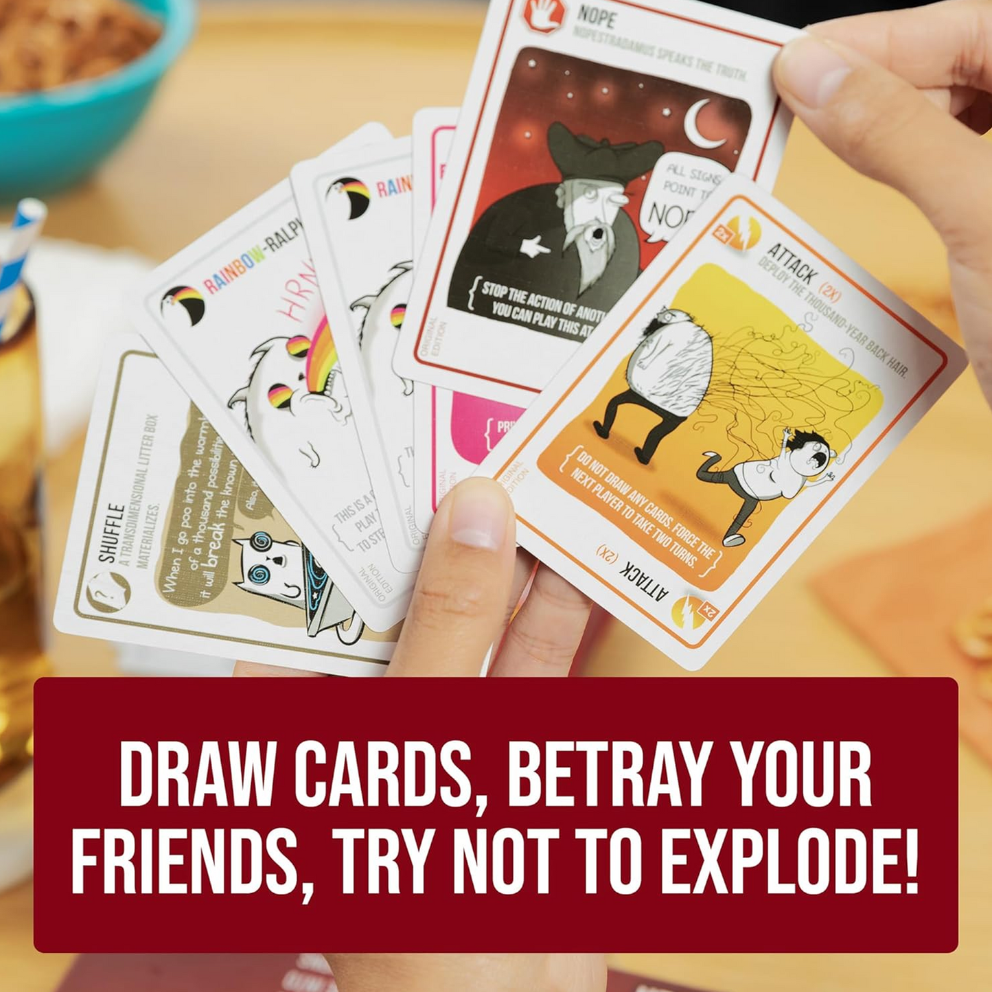 A Hand Holding a Selection of Cards From Exploding Kittens Original Edition Card Game | Happy Piranha