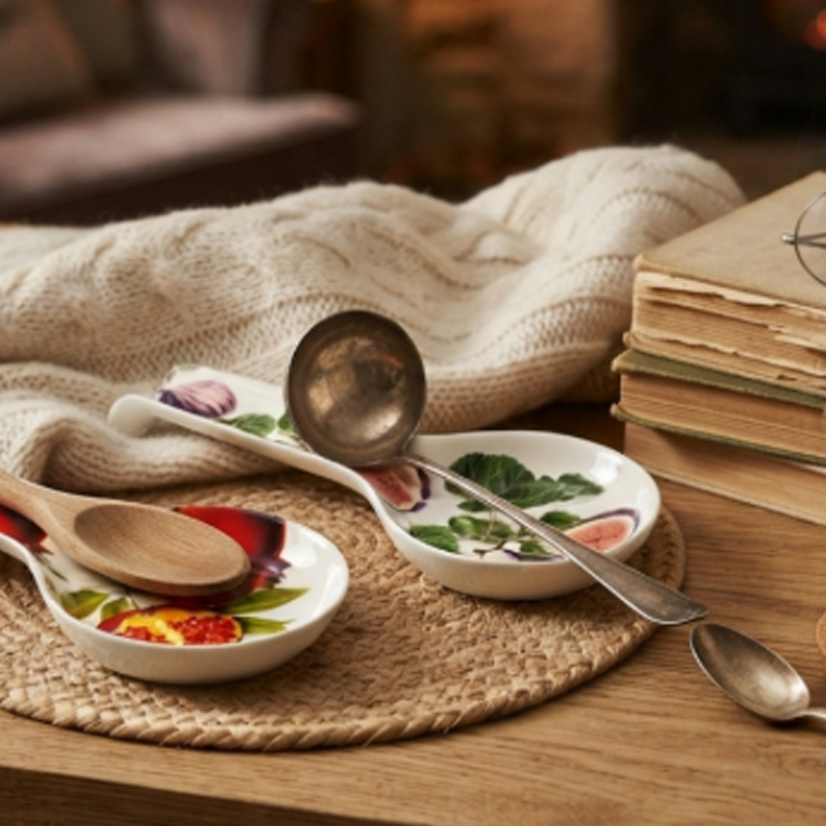 Cosy Home Fig Design Ceramic Spoon Rest on a Wooden Table next to a Blanket and Books under Cosy Lighting | Happy Piranha