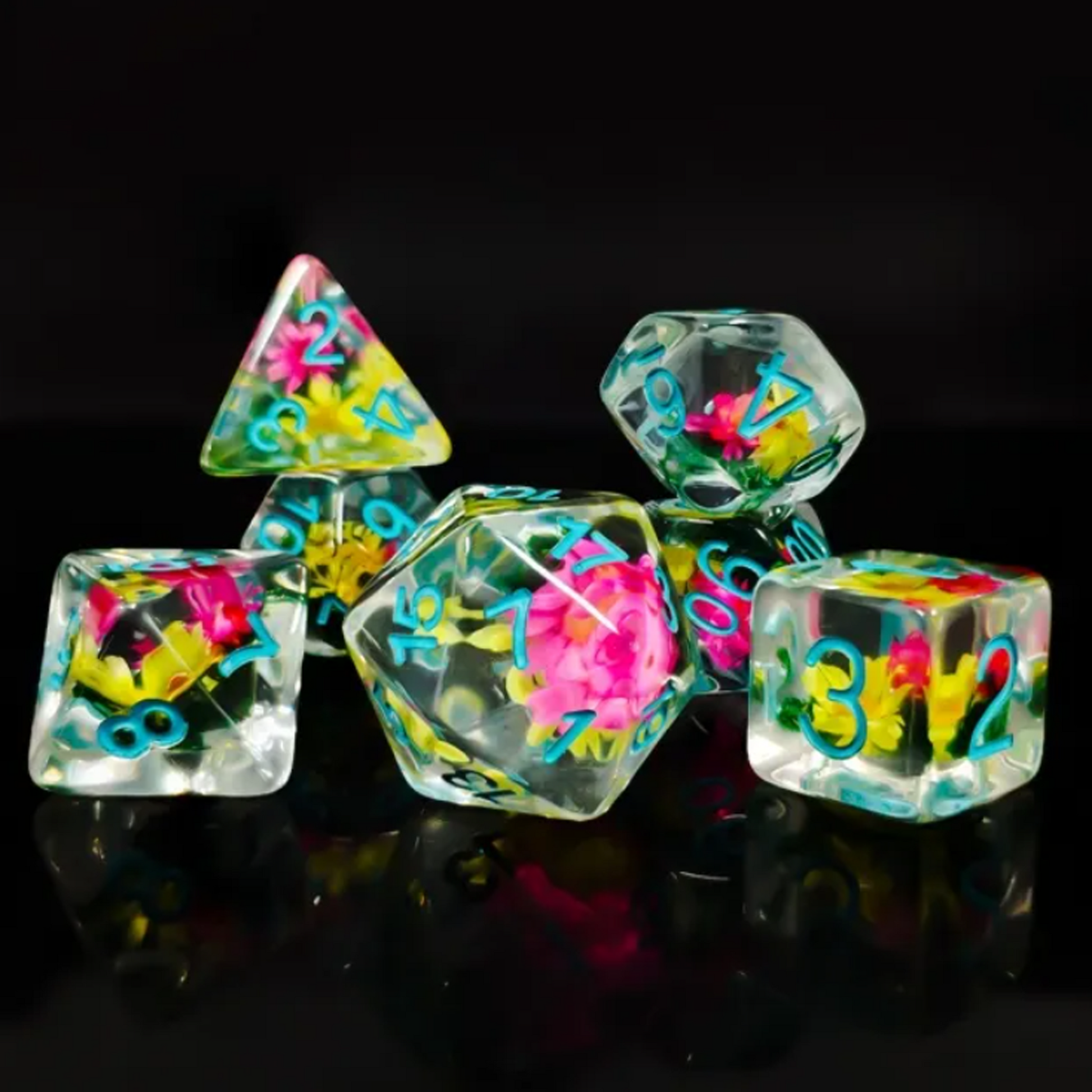 Flower Power! - Mini Flower Filled Polyhedral Dice Set Stacked up on a Black Background | Happy Piranha