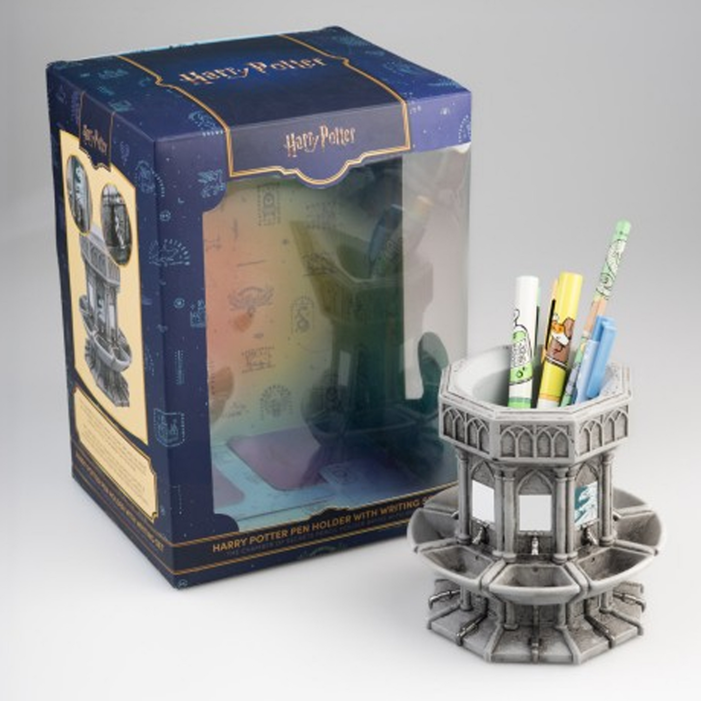 Harry Potter Moaning Myrtle's Bathroom Pen Holder & Stationary Set Next to Its Packaging on a White Background | Happy Piranha