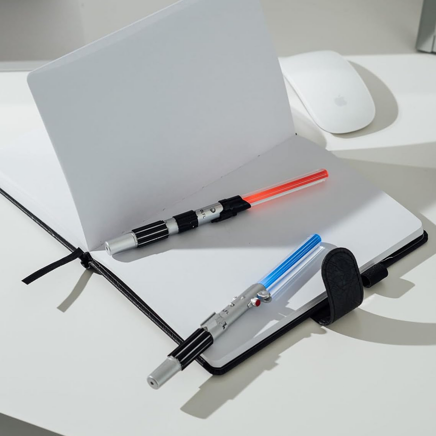 Star Wars Light Up  Lightsaber Pens 2 Set On top of a Notebook on a White Table | Happy Piranha