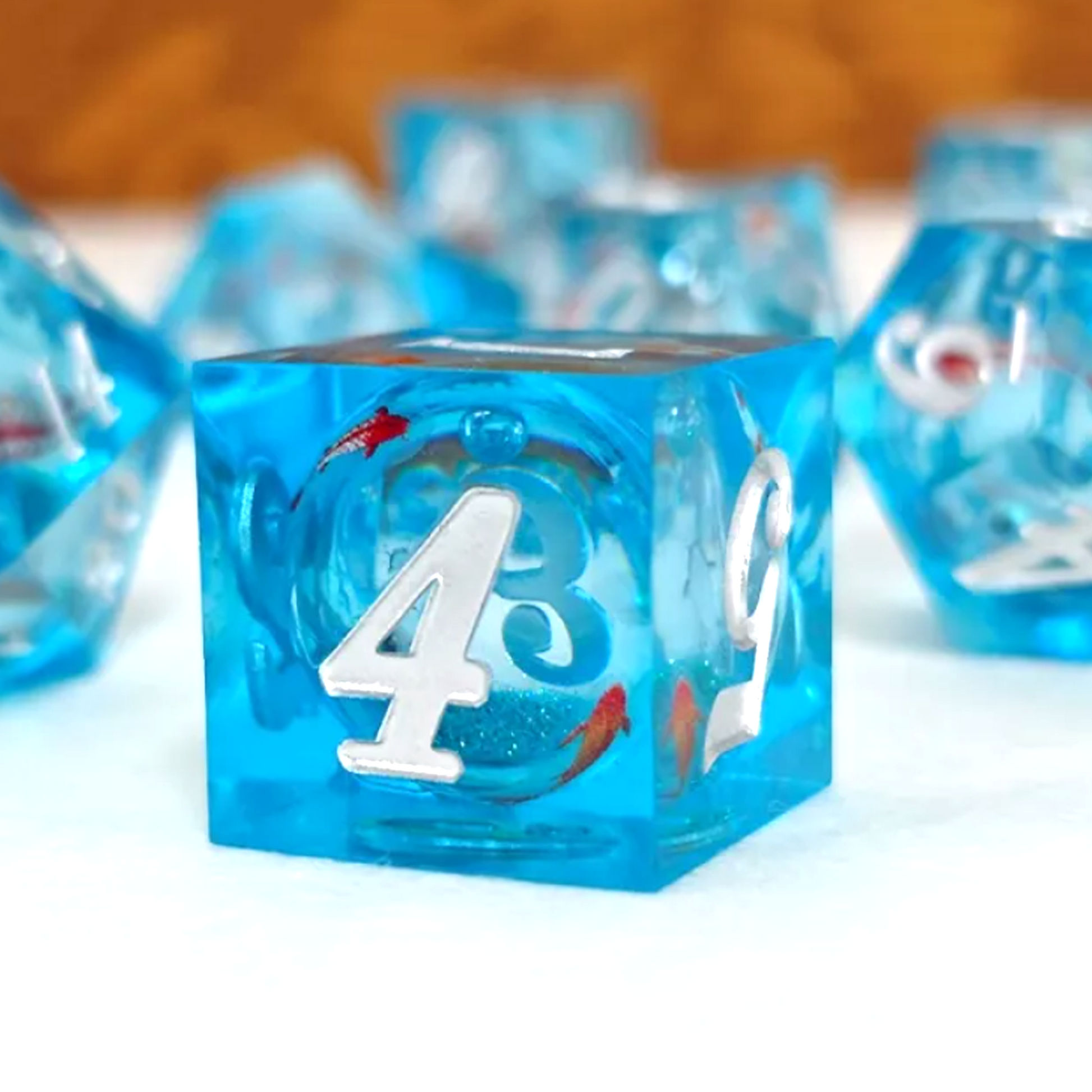 Koi Fish Liquid Core Sharp Edged Polyhedral Glitter D6 Close up on a White Background | Happy Piranha