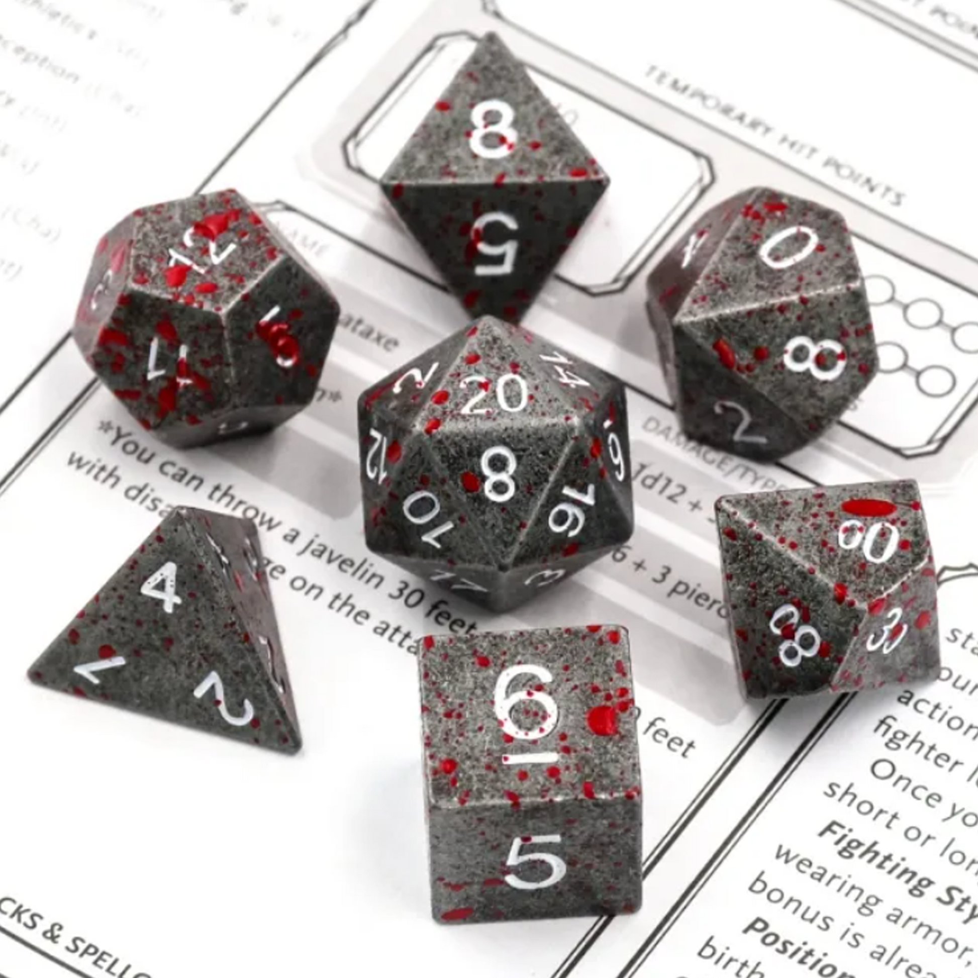 Blood Splatter - Premium Gun Metal Grey Polyhedral D&D Dice Set on a table | Happy Piranha