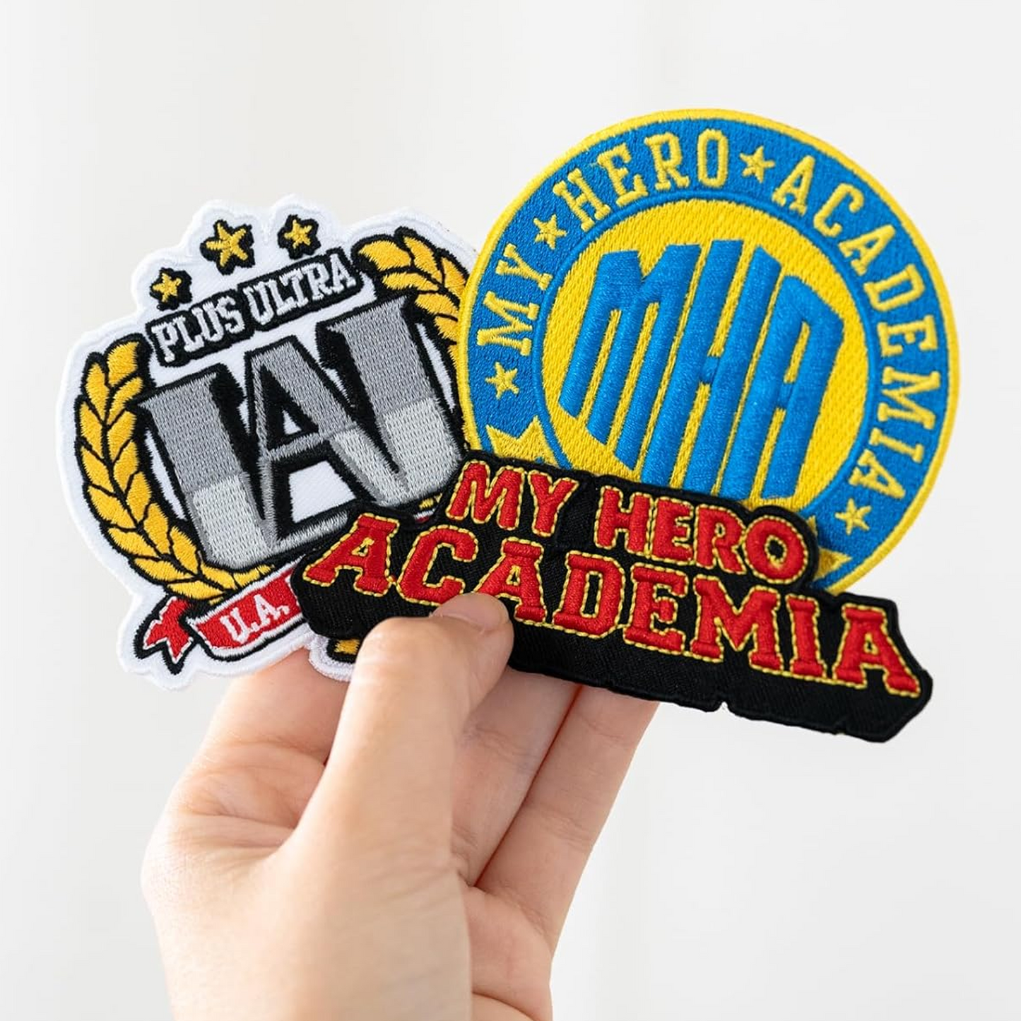 My Hero Academia Iron On Fabric Patches 3 Set in a Person's Hand on a White Background | Happy Piranha