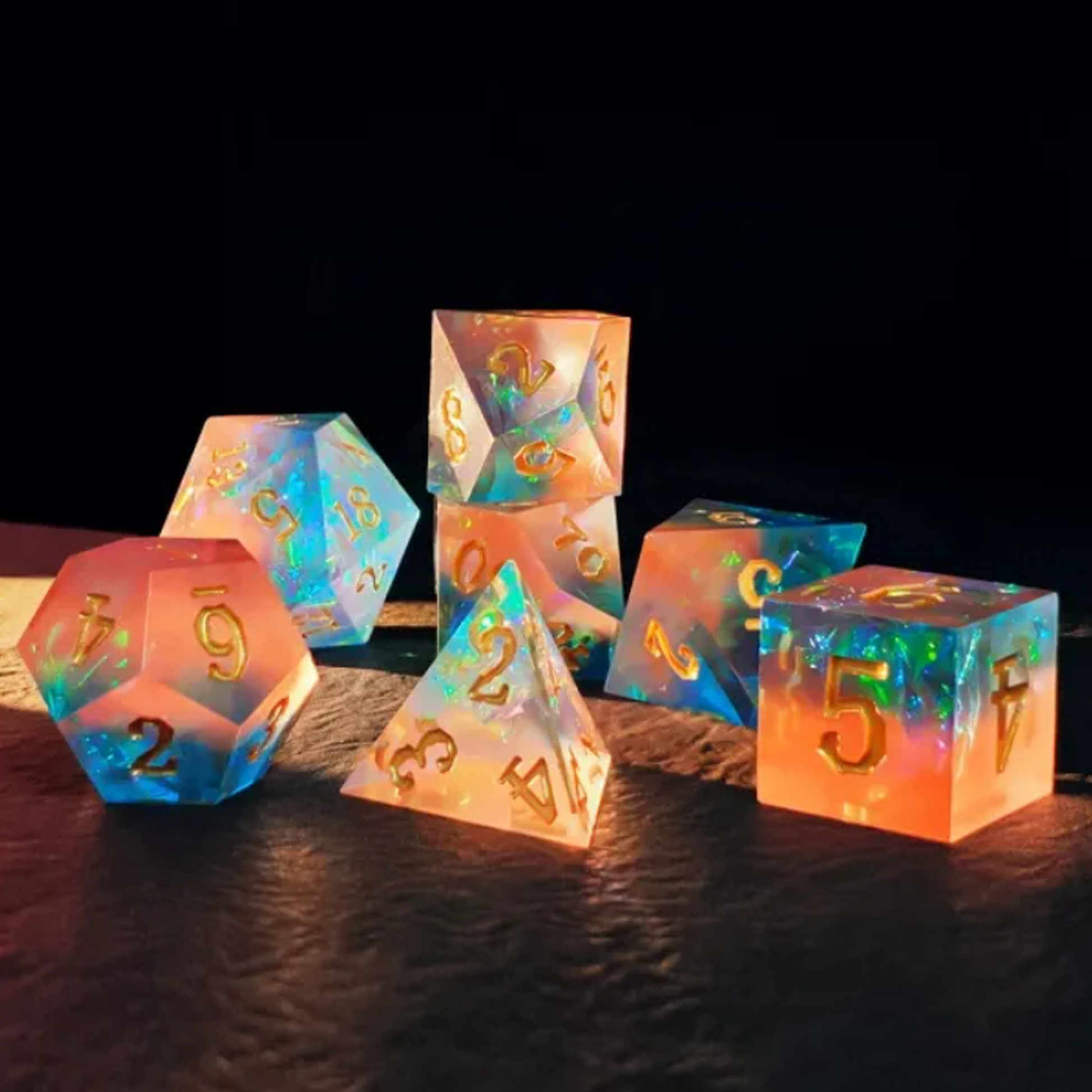 Peach Sunrise - Layered Sharp Edged Polyhedral Dice Set Stacked in a Pile on a Black Background With a Ray of Light Shining Through | Happy Piranha