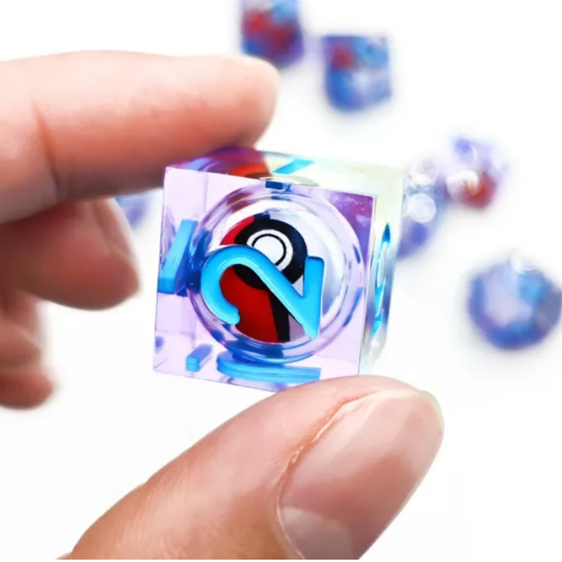 A Pokeball: Liquid Core Sharp Edged Rolling Ball Polyhedral D6 Held in a Persons Hand | Happy Piranha