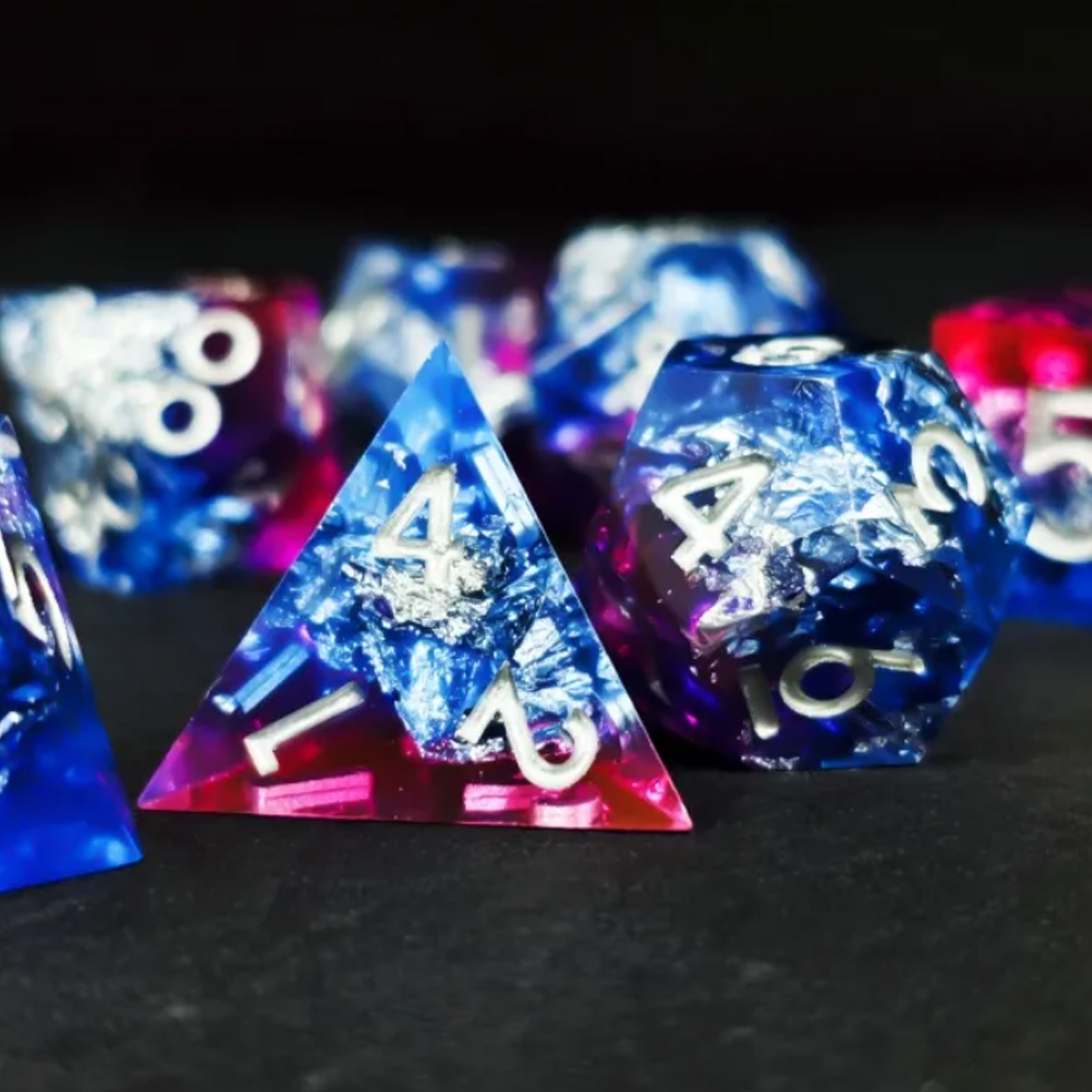 Purple Glacier - Layered Sharp Edged Polyhedral Dice Set Close up if the D12 on a Black Background | Happy Piranha
