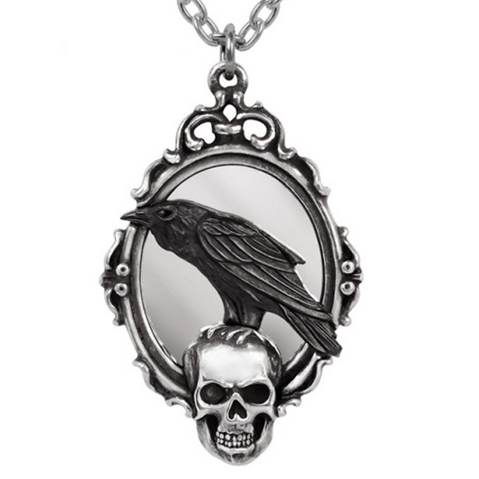 A Black Raven Sitting on a Skull & Gothic Mirror Design Pewter Pendant Necklace on a White Background | Happy Piranha