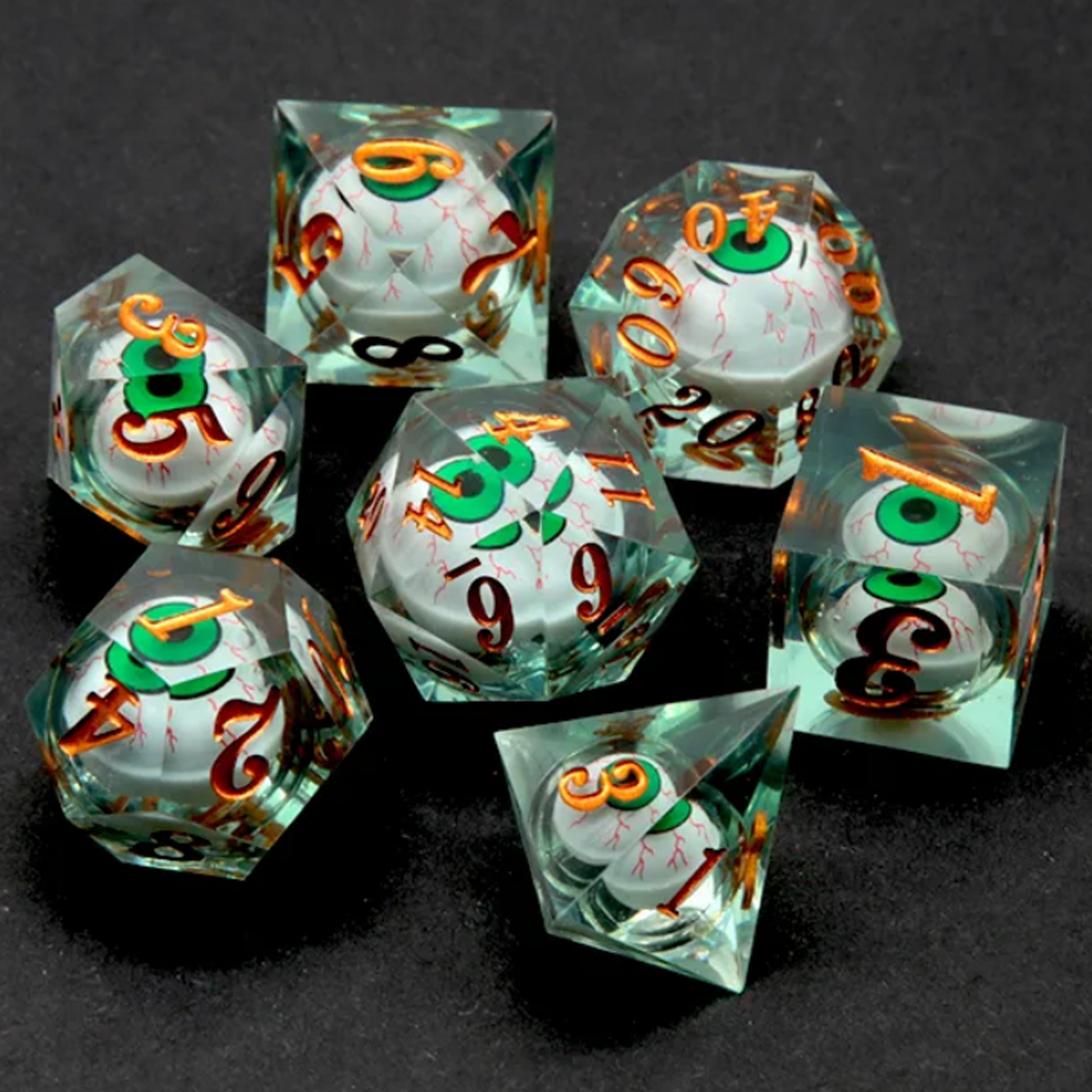 Green Rolling Eyes: Liquid Core Sharped Edged Polyhedral Dice Set Spread Out on a Black Background | Happy Piranha