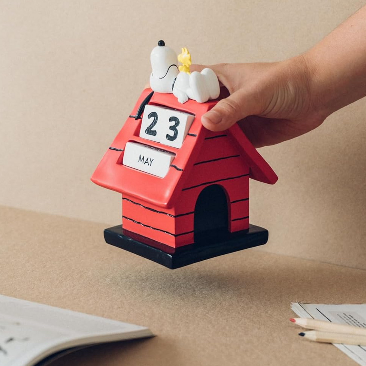 Snoopy & Woodstock Dog House Perpetual Calendar (in a Person's Hand) | Happy Piranha