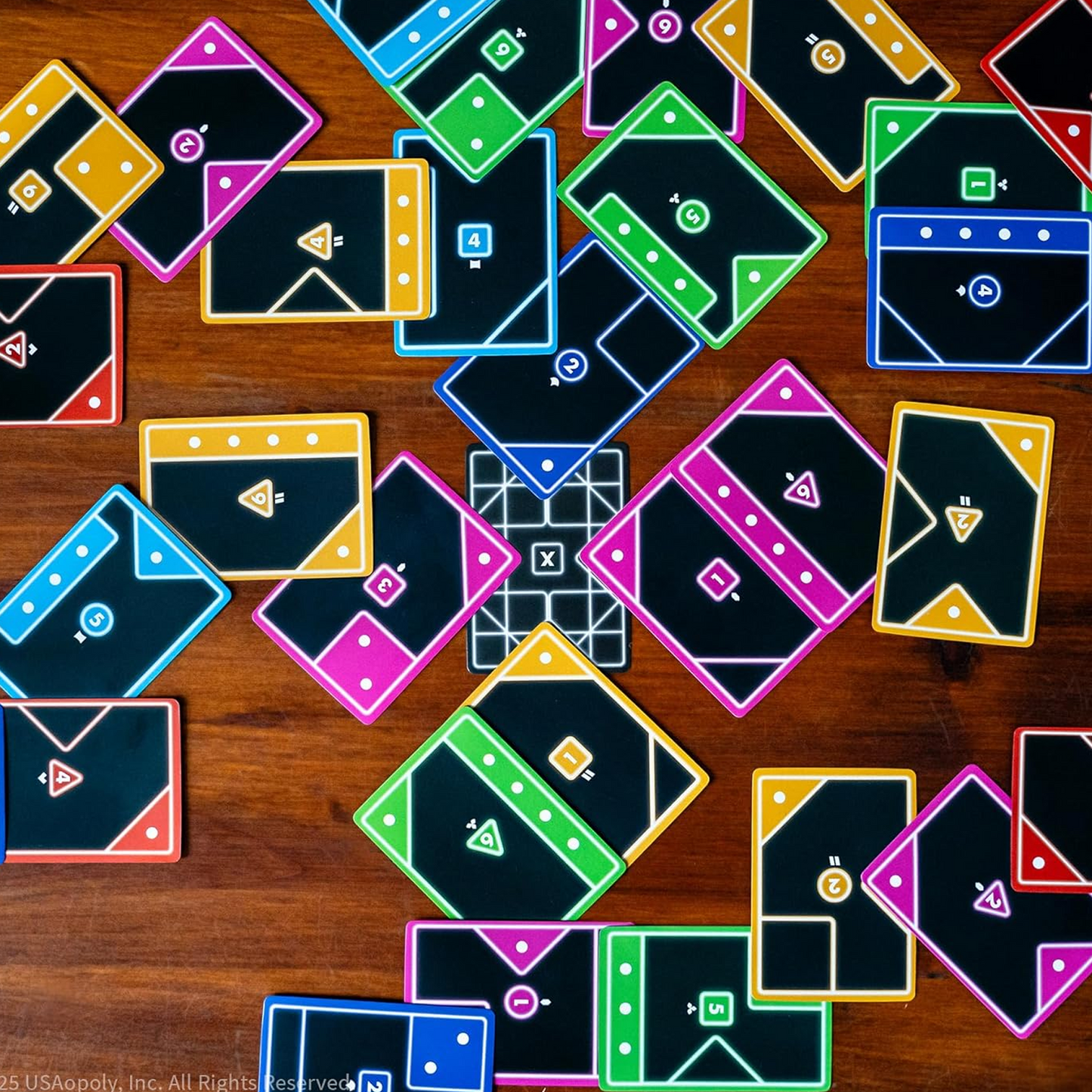 Tacta: Connect, Cover, Conquer Card Game - Cards Laid out on a Wooden Table | Happy Piranha