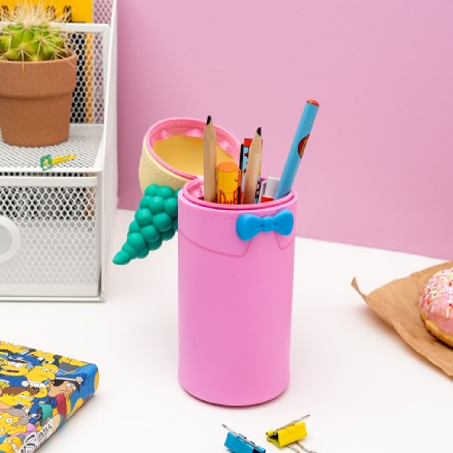 The Simpsons Krusty the Clown 3D Silicon Pencil Case Open and With Pens and Pencils Inside on a White Desk with a Pink Wall Behind | Happy Piranha