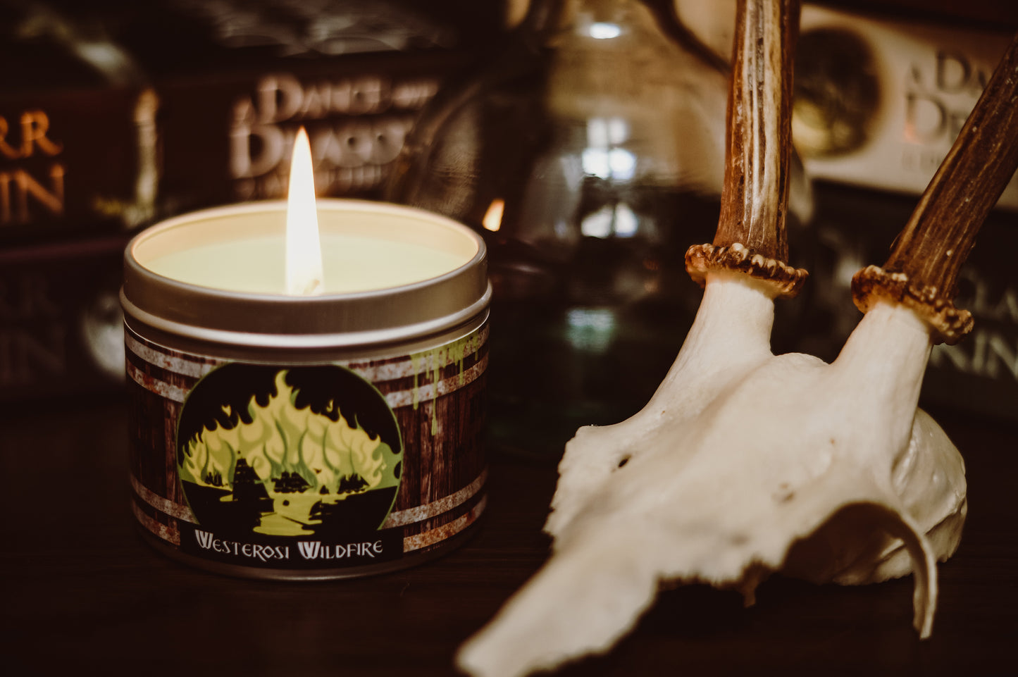Happy Piranaha's Westerosi Wildfire scented candle alight by skull