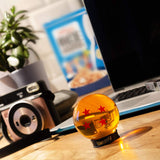 Dragon Ball Z Goku's 4 Star Dragon Ball Replica  on a computer desk | Happy Piranha