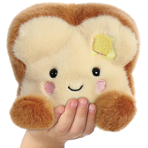 Buttery Toast Palm Pal Soft Toy in a Child's Hand | Happy Piranha