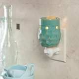 Turquoise Honeycomb: Plug in Fragrance and Wax Melt Warmer Plugged in a Kitchen Wall | Happy Piranha