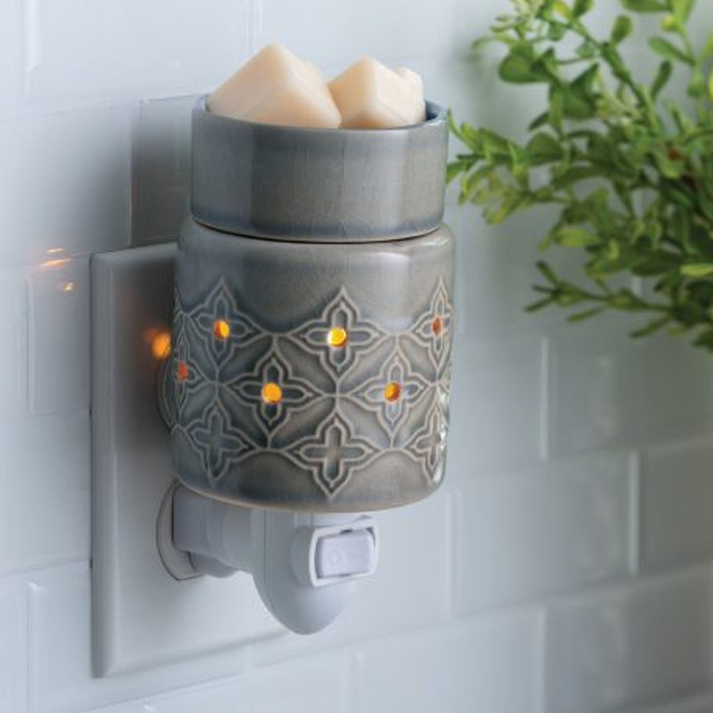 Jasmine: Plug in Fragrance and Wax Melt Warmer Plugged in to a Tiled Wall | Happy Piranha