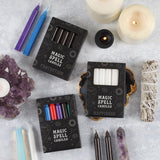 Magic Spell Candles Pack on a table with crystals and incense | Happy Piranha