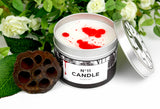 Number eleven scented candle with lid off and red and white wax.