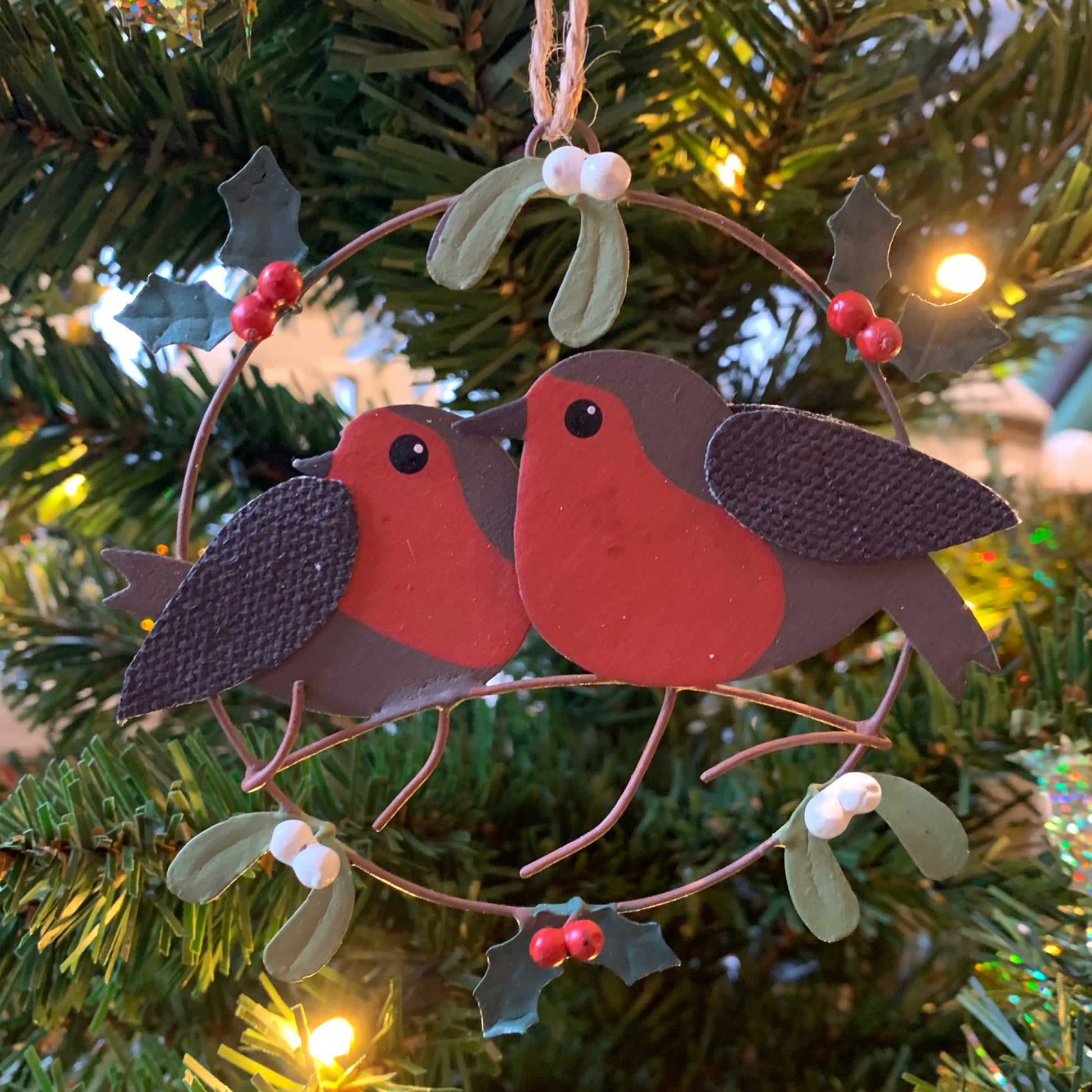 Pair of Robins in a Ring Hanging Christmas Decoration in a Christmas Tree  | Happy Piranha