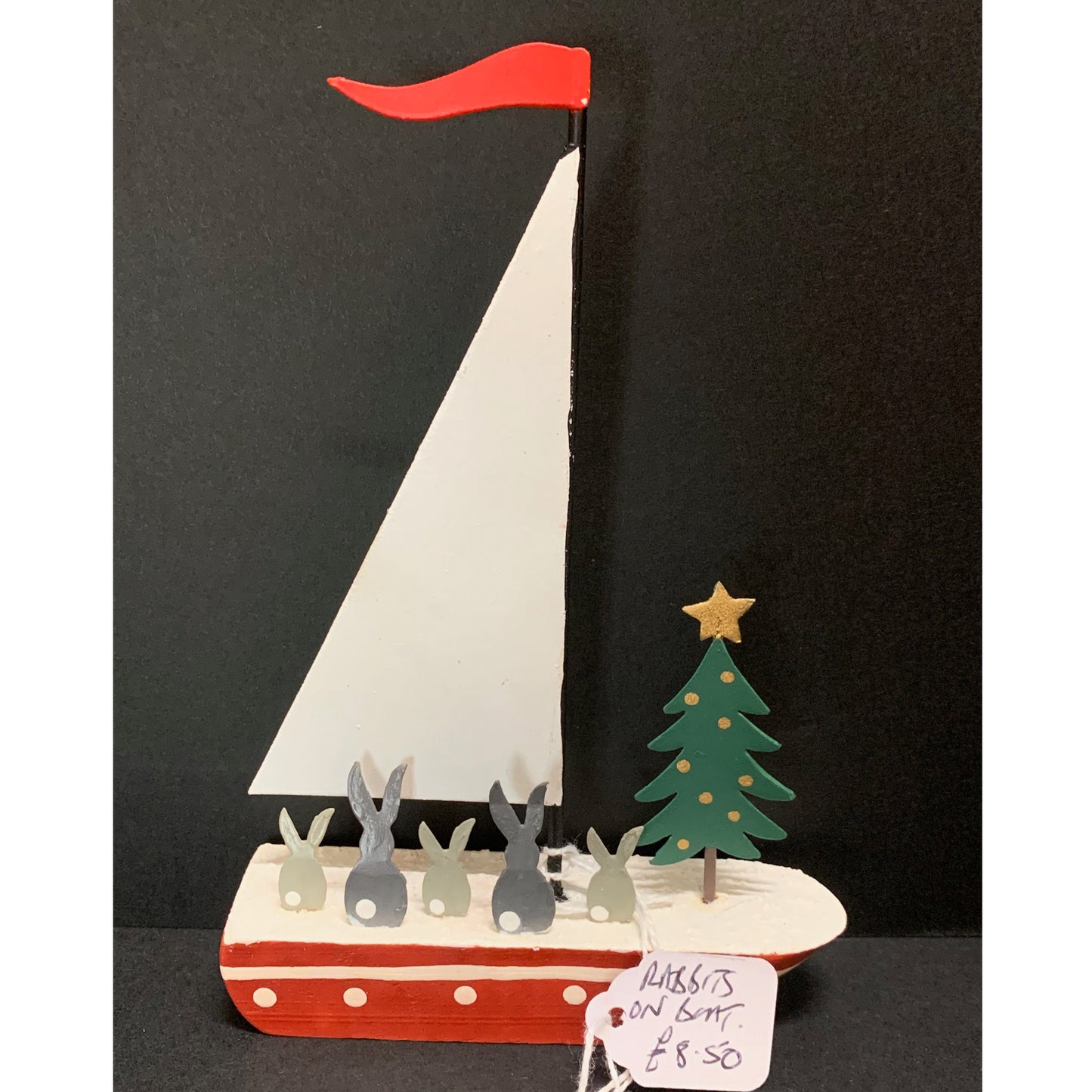 Rabbits on a Boat: Christmas Decoration on a Black Background | Happy Piranha