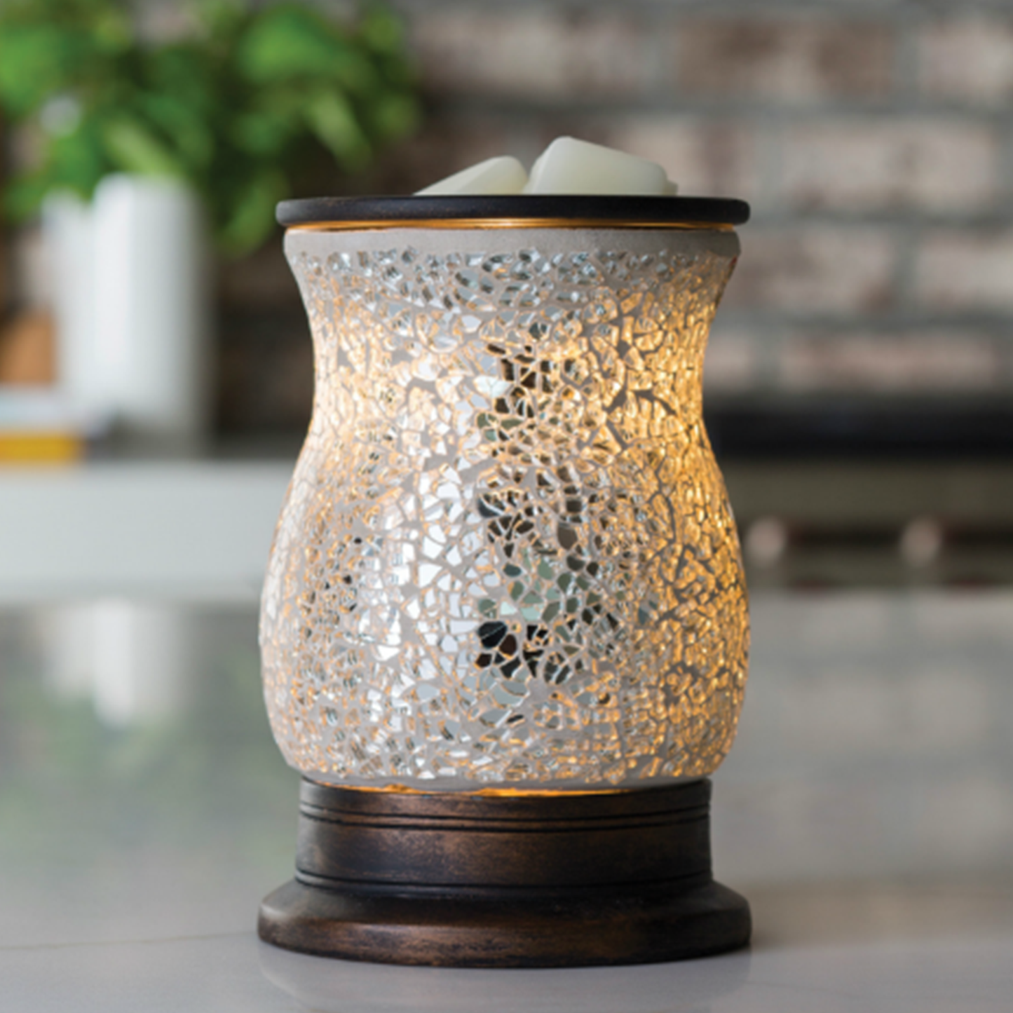 Reflection - Illumination Wax Melt Warmer Lit up on a Coffee Table | Happy Piranha