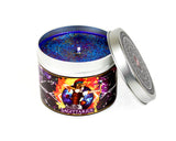 Sagittarius scented candle with lid off and blue glittery wax.