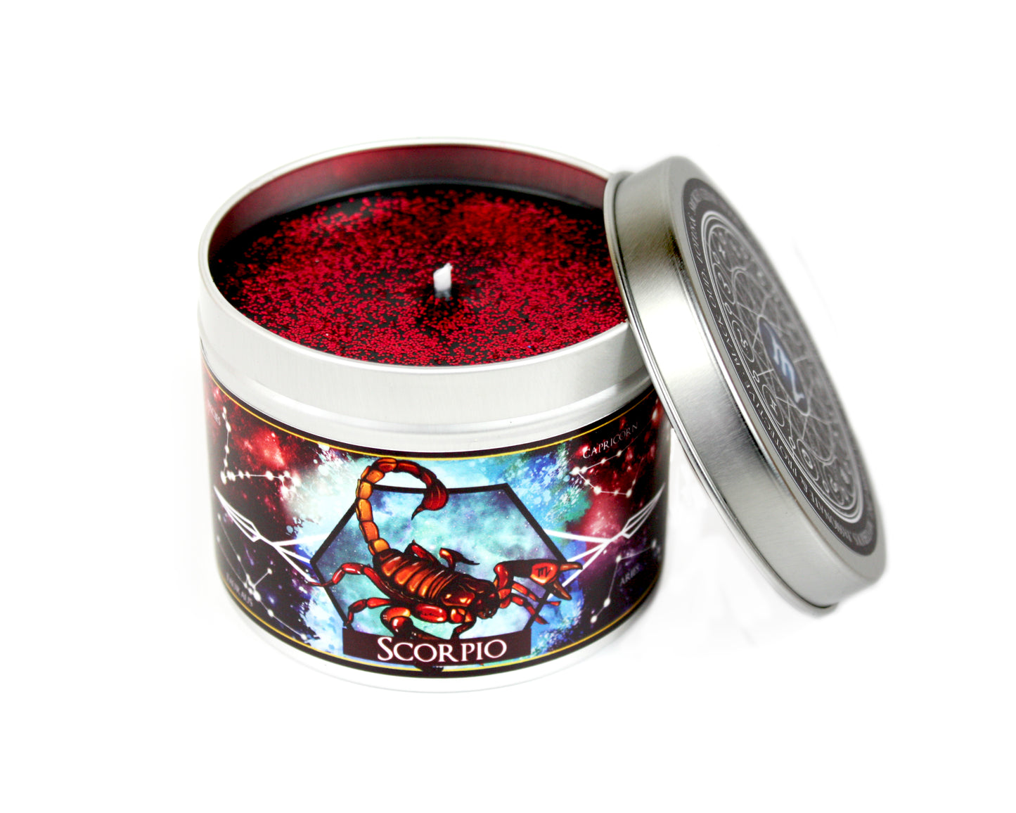 Scorpio zodiac scented candle with lid off and red glitter.