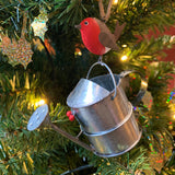 Robin on a Watering Can Hanging Christmas Decoration in a Christmas Tree  | Happy Piranha